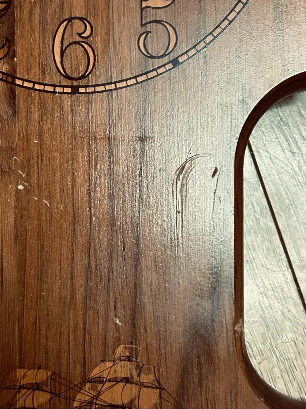 Bulova wall clock features a unique wooden casing shaped like a stylized ship
